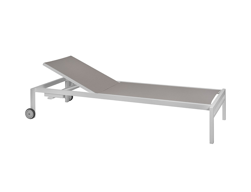 The image shows an adjustable sun lounger with dove-colored fabric and a aluminum frame. The sun lounger has a raised headrest, suggesting it can be adjusted for comfort. Two small wheels are attached to one end of the frame, indicating that the sun lounger can be easily moved.